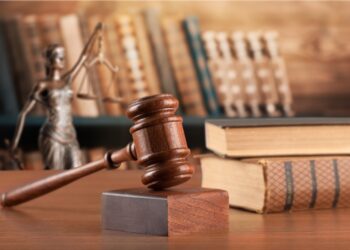 wooden justice or law gavel and stack books