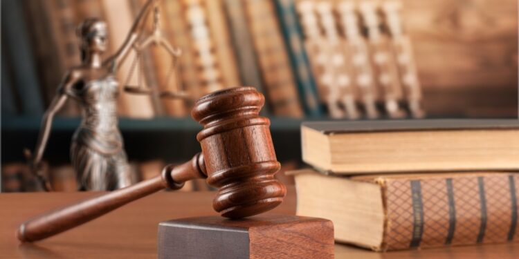 wooden justice or law gavel and stack books