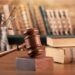 wooden justice or law gavel and stack books