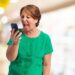 portrait of angry mature woman talking on telephone