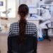 back view of woman in dentist office waiting for consultation