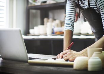 craftsman browsing laptop connection technology concept
