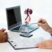 close up during consultation of a male patient suspected of having bacterial prostatitis. prostate disease and treatment anatomical model of the male reproductive system in the hands of a doctor.