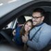 happy young couple enjoying their brand new car.