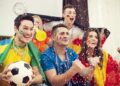 multinational football supporters celebrating goal