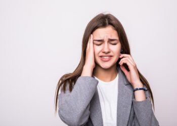 portrait of stressed businesswoman isolated over white background