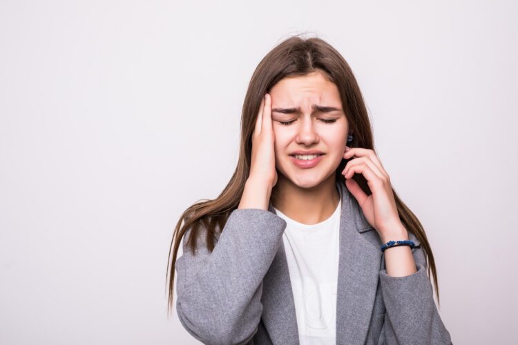 portrait of stressed businesswoman isolated over white background